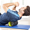 image of man using foam roller.
